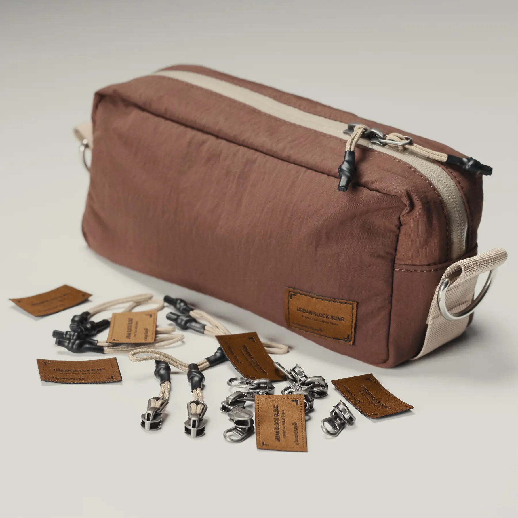 Brown Urban Block Sling with interchangeable carry hardware