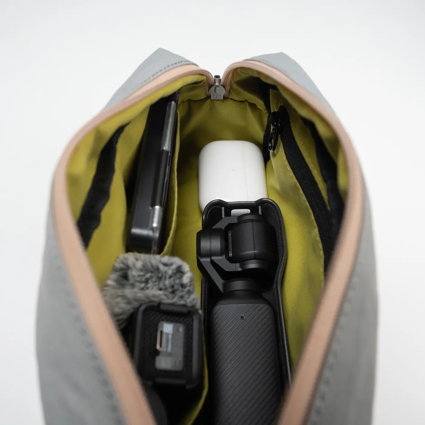 Interior organizers holding a compact camera and accessories